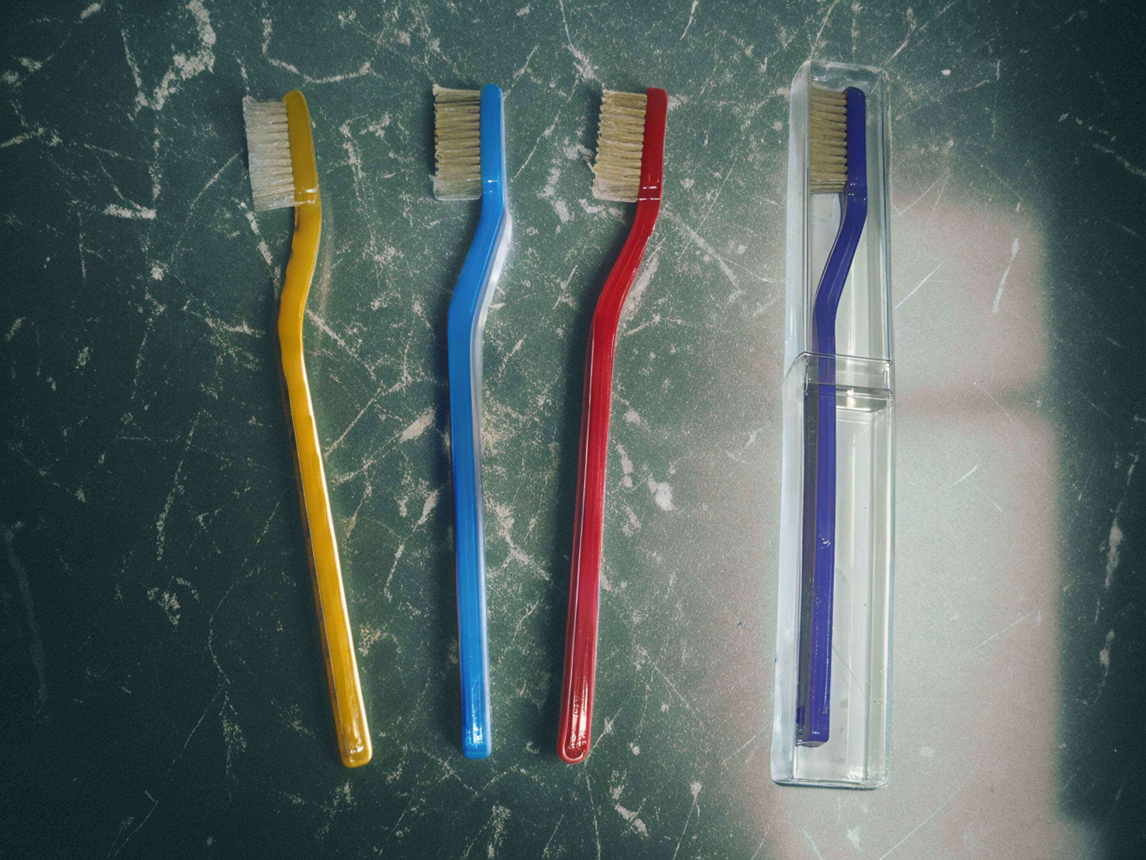 A toothbrush tufted by YC Brushes